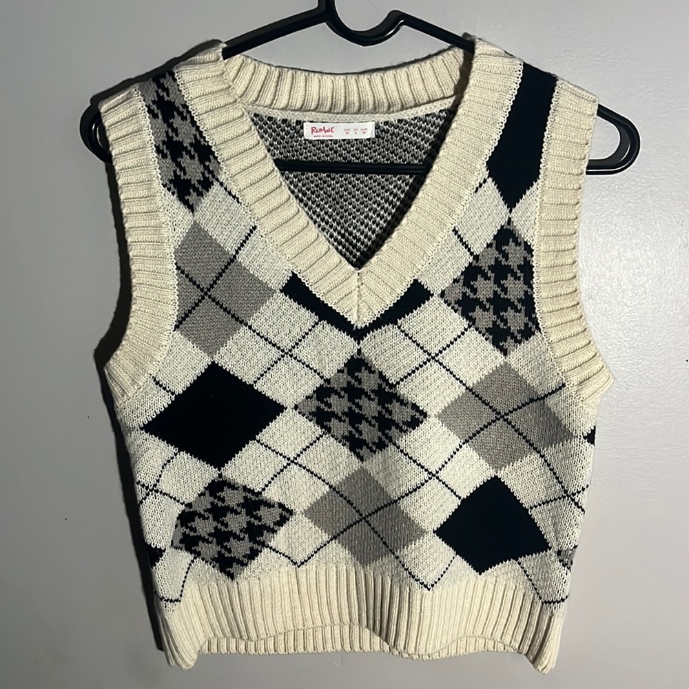 White, black, cream vest.